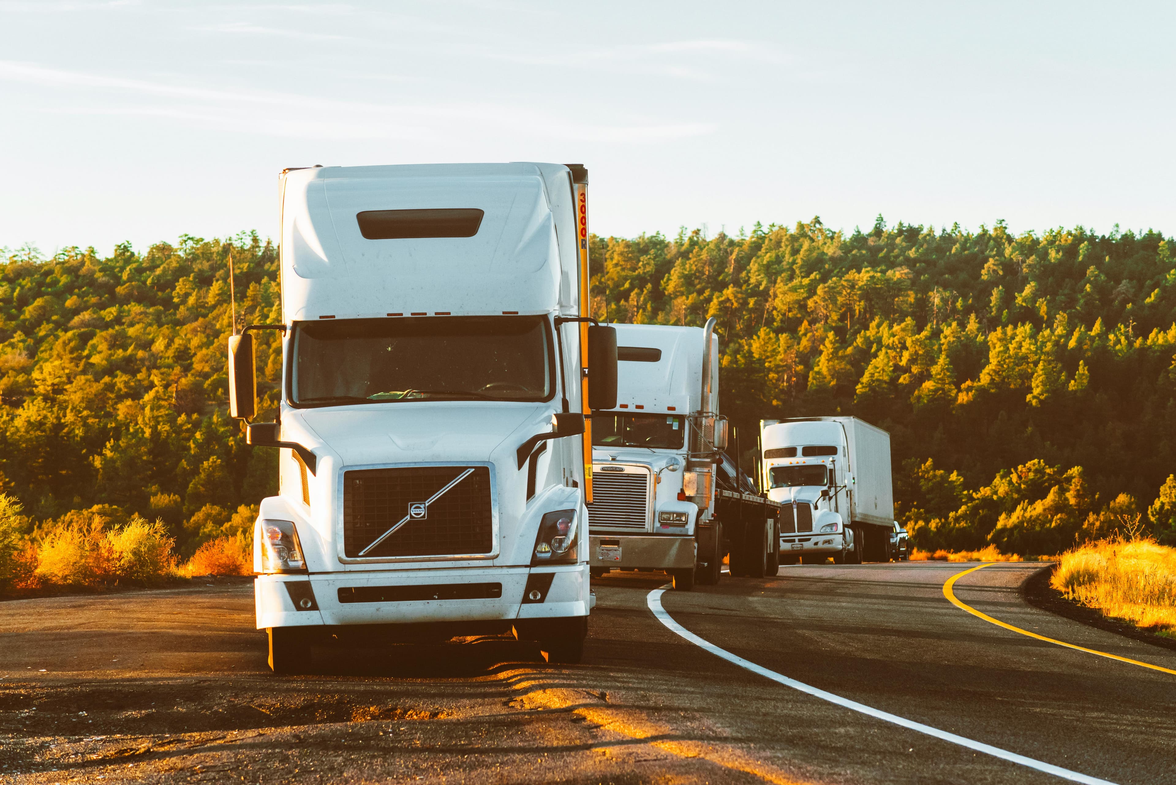 Freight truck on highway at sunset